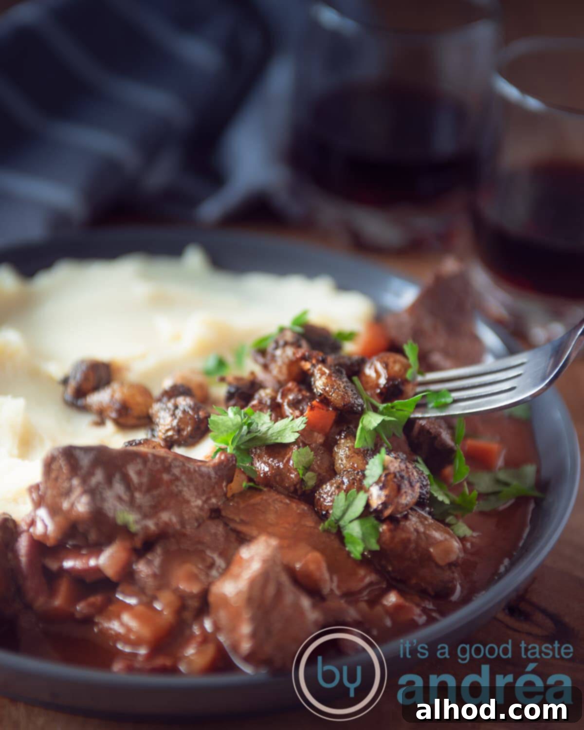 Slow Cooker Beef Bourguignon Without Mushrooms 5 A hearty serving of Boeuf Bourguignon, a classic French dish, presented beautifully.