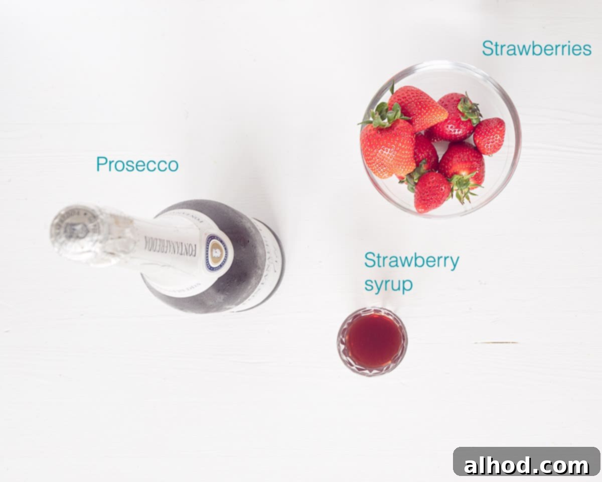 Strawberry Prosecco Fizz 3 Ingredients for Strawberry Prosecco cocktail laid out on a white background with descriptive text, including fresh strawberries, strawberry syrup, and a bottle of Prosecco.