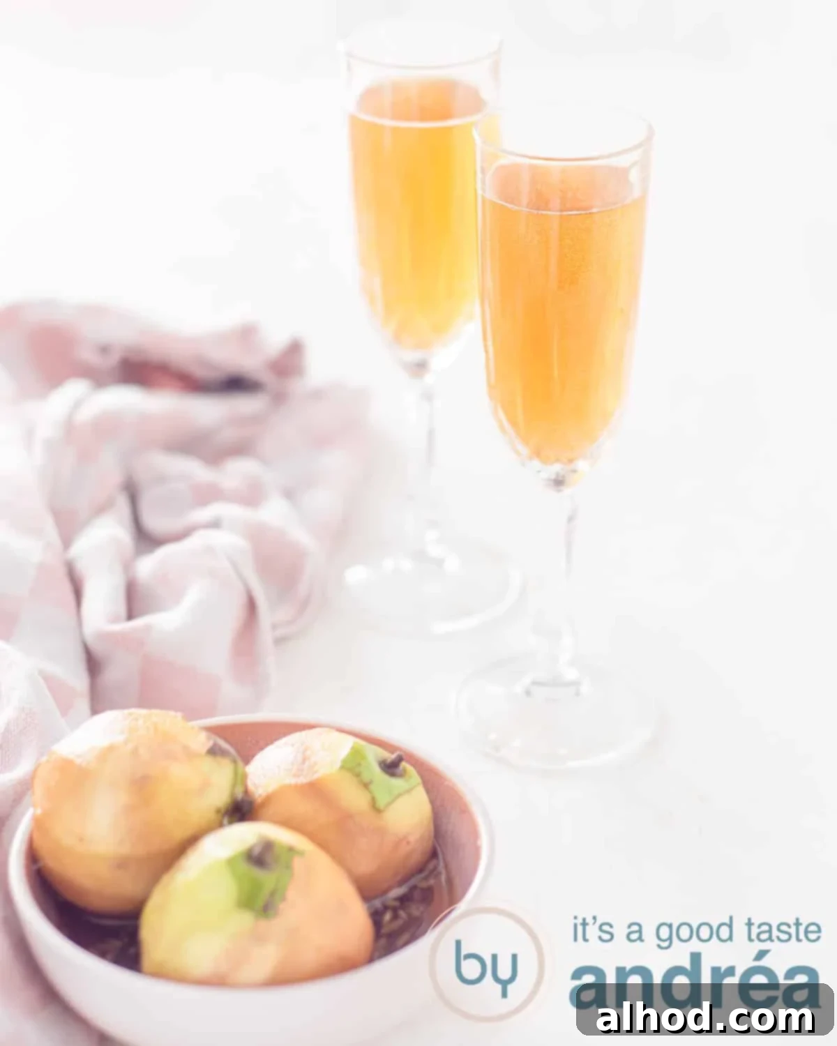 Sparkling Pear Elixir 2 Two delicious cocktails with stewed pears and champagne. In the foreground on the left a dish with stewed pears.