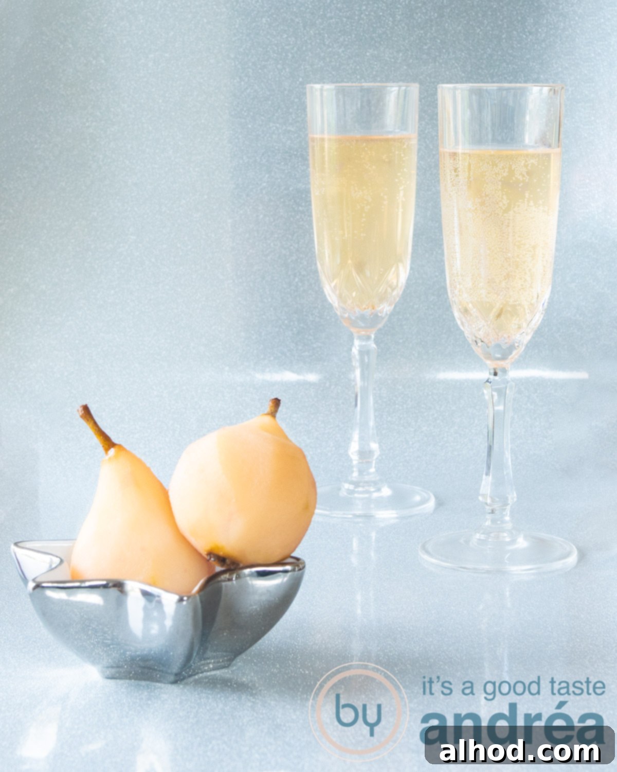Sparkling Pear Delight 5 Two delicious stewed pear champagne cocktails in the background. In the foreground a bowl with stewed pears.