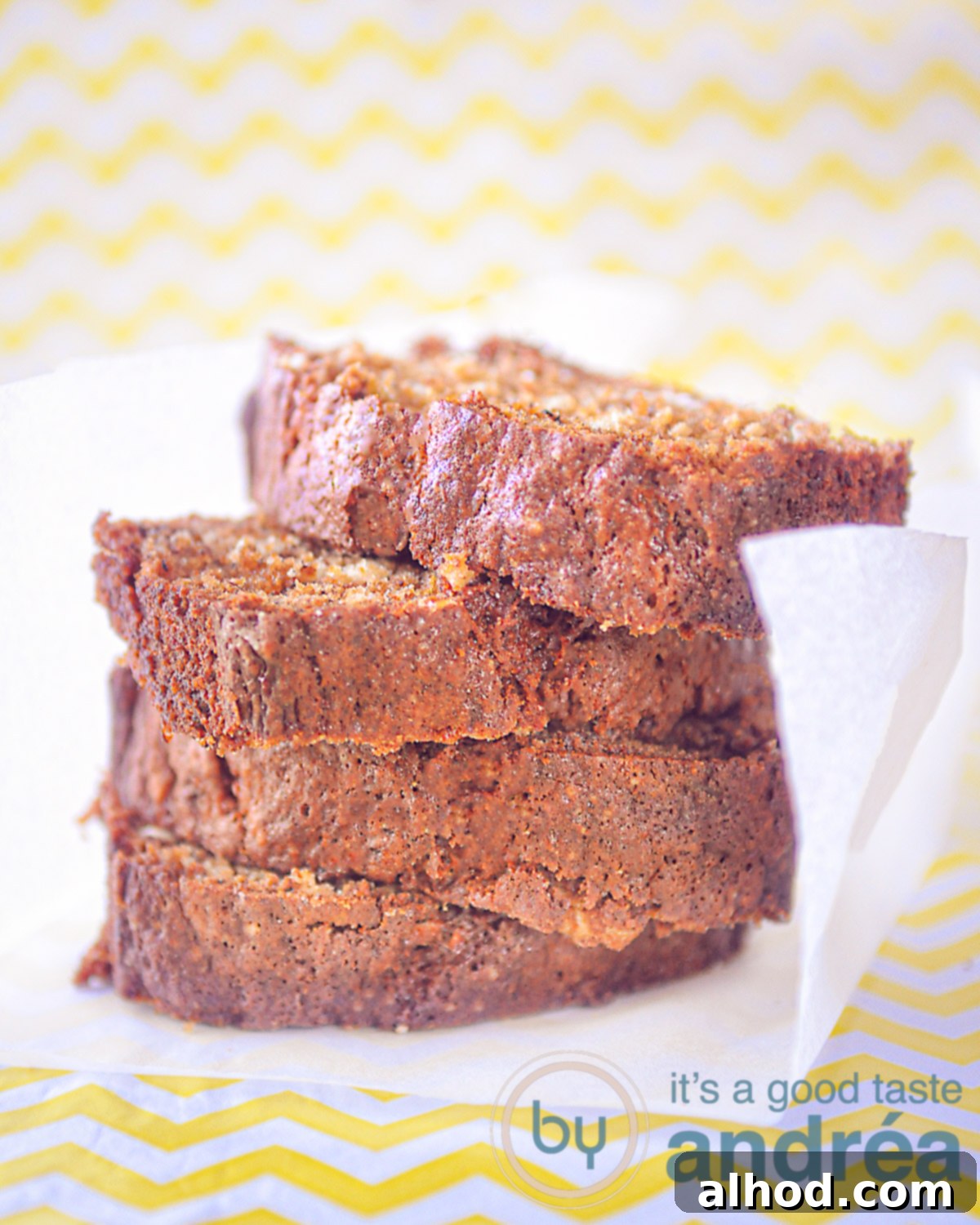 Golden Banana Pound 4 A delectable slice of moist banana bread pound cake, showcasing its tender crumb and golden-brown crust, ready to be enjoyed.