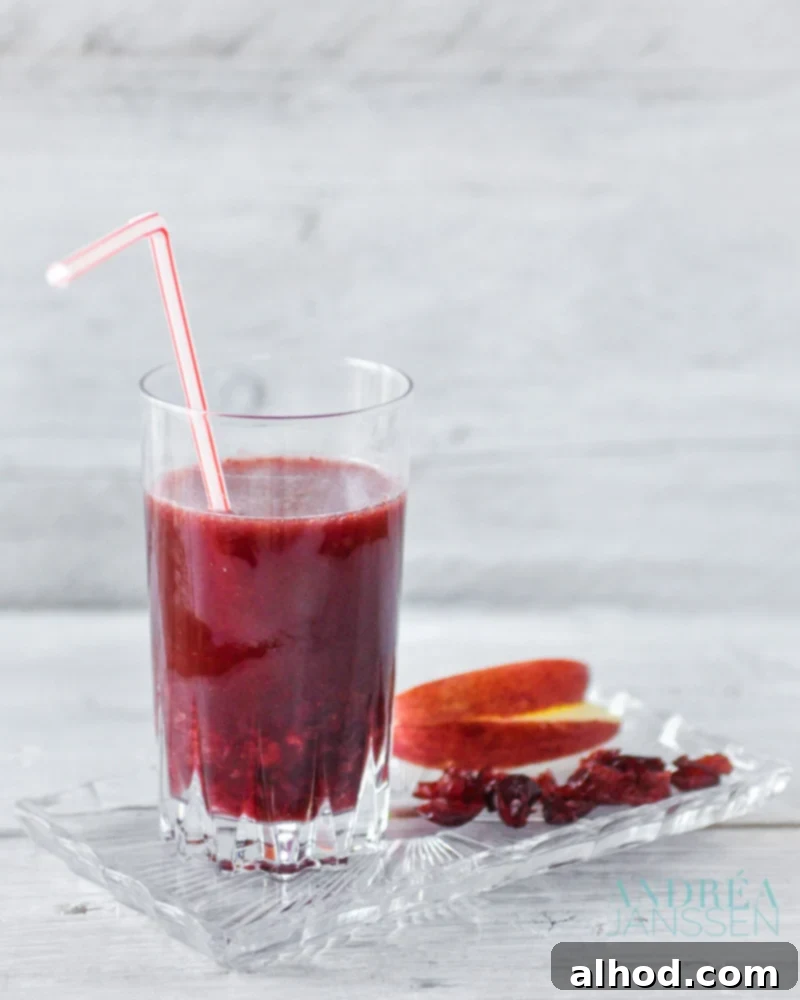 Zesty Cranberry Apple Blend 2 Cranberry apple smoothie, a healthy and refreshing drink with vibrant red color