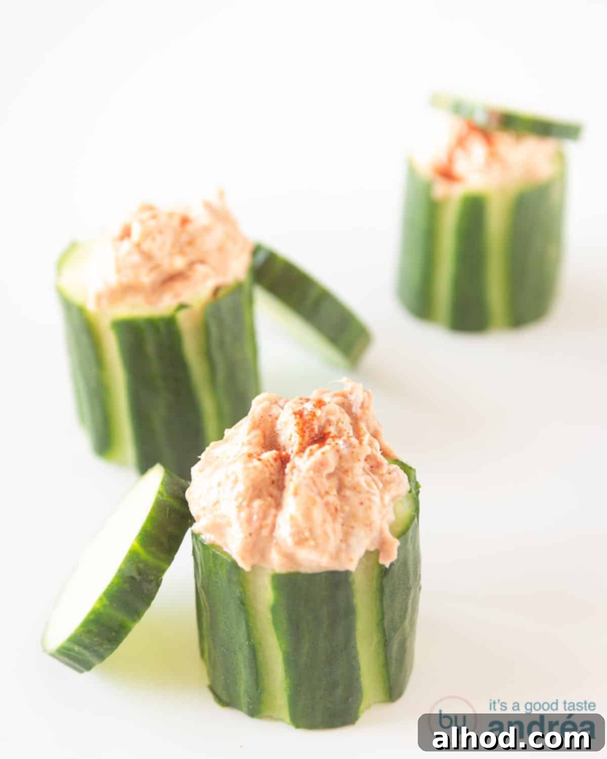 Healthy Bites for Afternoon Energy 7 A refreshing cucumber tuna appetizer, featuring hollowed-out cucumber halves generously filled with a flavorful tuna salad. This protein-rich snack is both nutritious and visually appealing, perfect for a light and healthy bite.