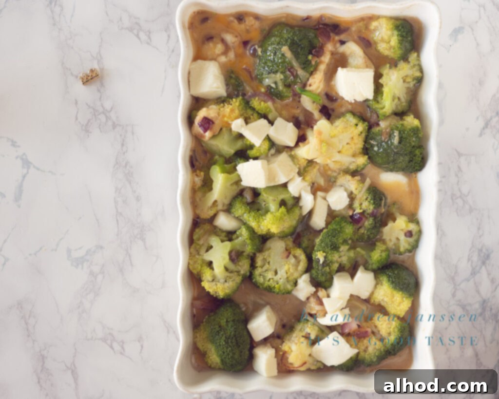 Step 4: Top with remaining mozzarella and bake until golden.