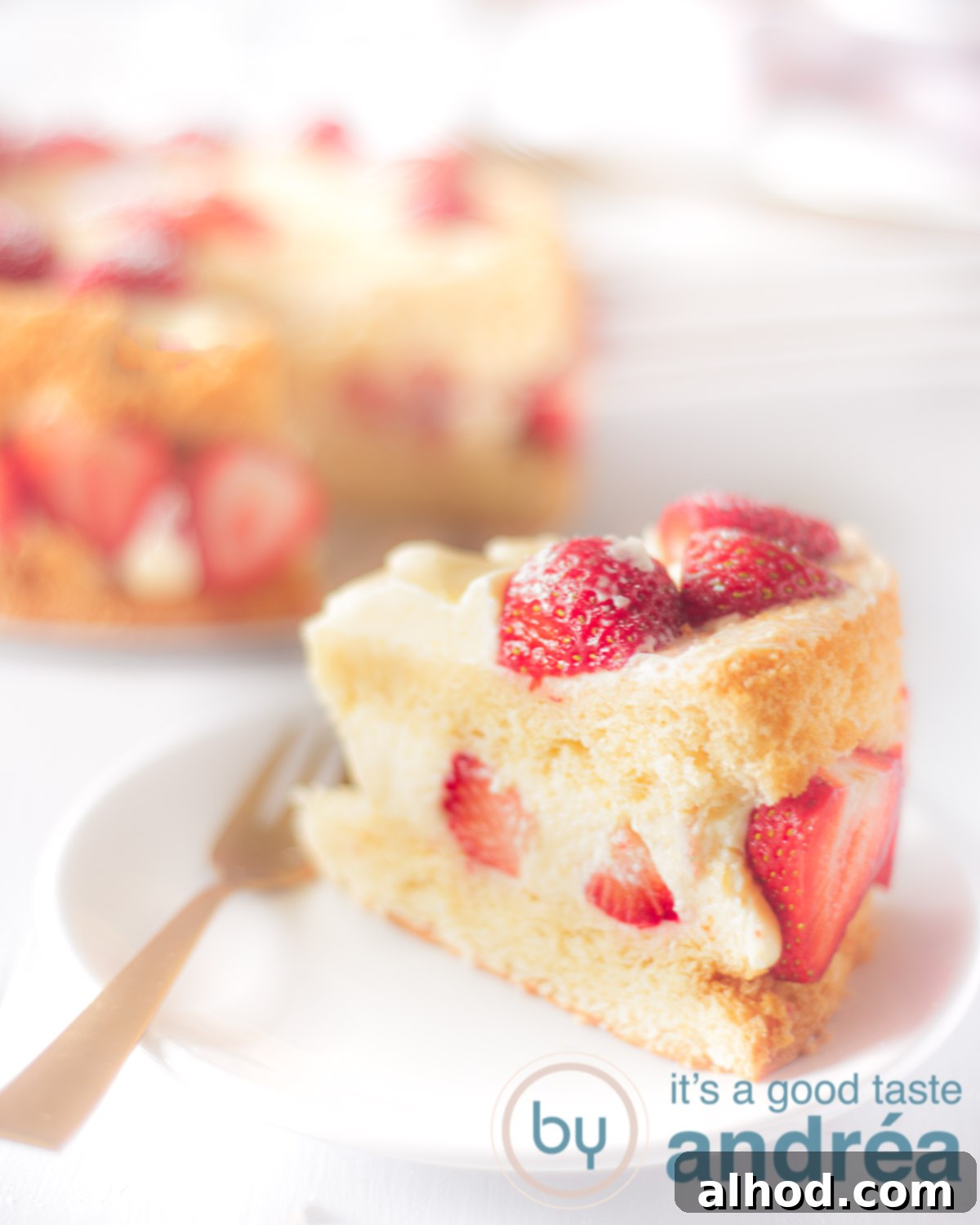 Heavenly Strawberry Cloud Cake 7 Strawberry chiffon cake part on a cake spoon