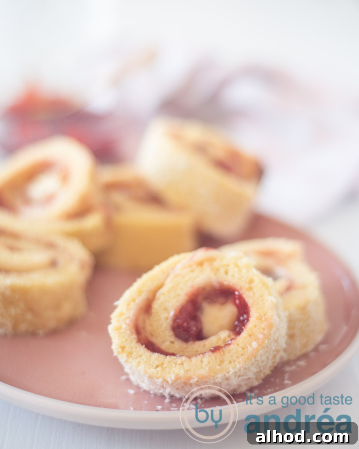 Strawberry Swiss Roll 5 Strawberry cake rolls on a white plate
