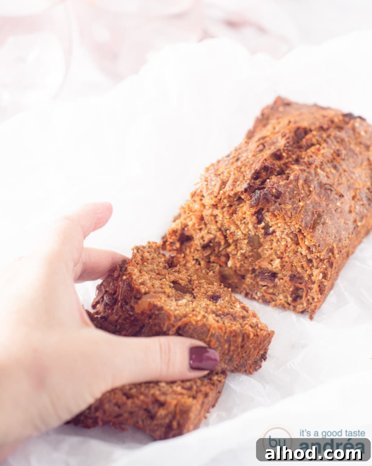 Wholesome Sugar-Free Carrot Cake Loaf 2 Lactose free carrot cake loaf, perfectly sliced and ready to serve on a wooden board.