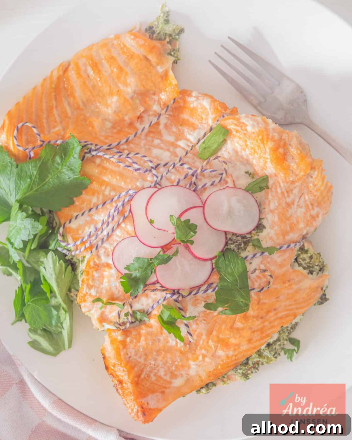 Creamy Spinach & Celery Stuffed Salmon 3 An overhead photo of a salmon fillet stuffed with a creamy spinach celery mixture, ready for baking.
