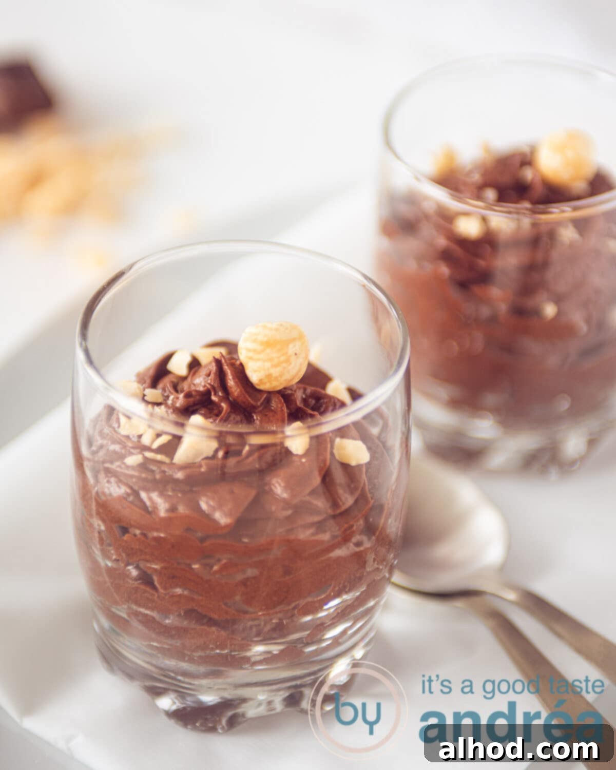 Dreamy Chocolate Mousse (No Cream Needed) 2 Two glasses filled with dark chocolate mousse and hazelnuts