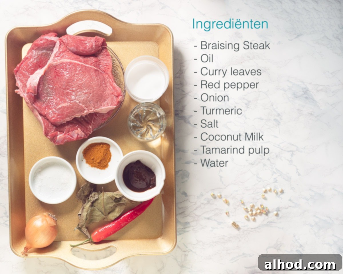 Lacy Sri Lankan Hoppers with Rich Beef Curry 3 Ingredients for Sri Lankan Beef Curry laid out on a golden tray with a marbled surface and a text list on the side.