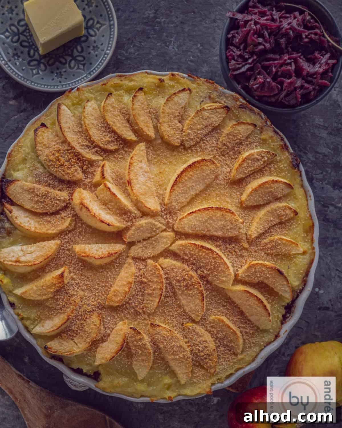 Heritage Dutch Rump Pot Roast 3 A photo from above of a round quiche dish filled with a Dutch jachtschotel dish with apple, mashed potatoes and stew.