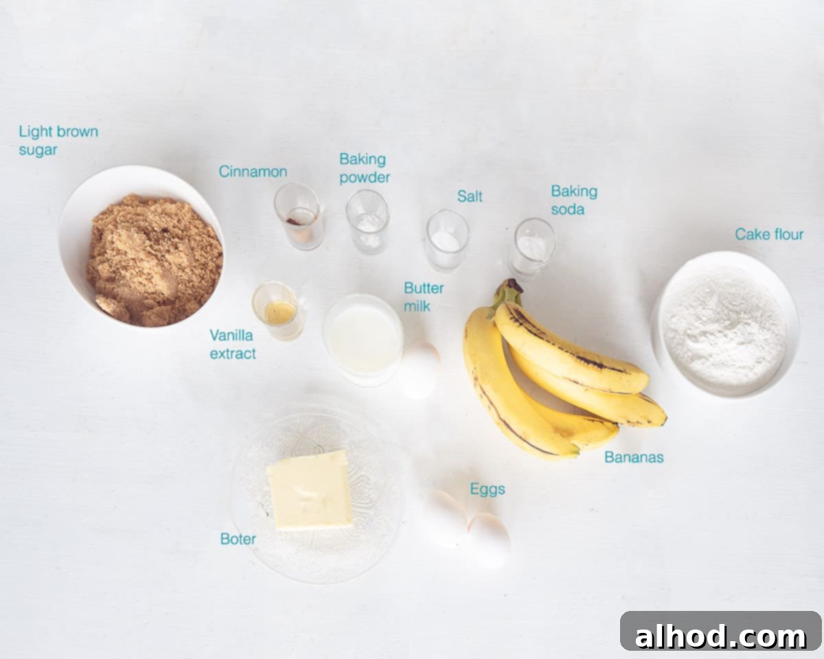 Individual ingredients for banana cupcakes laid out on a white background, including flour, bananas, sugar, and butter.