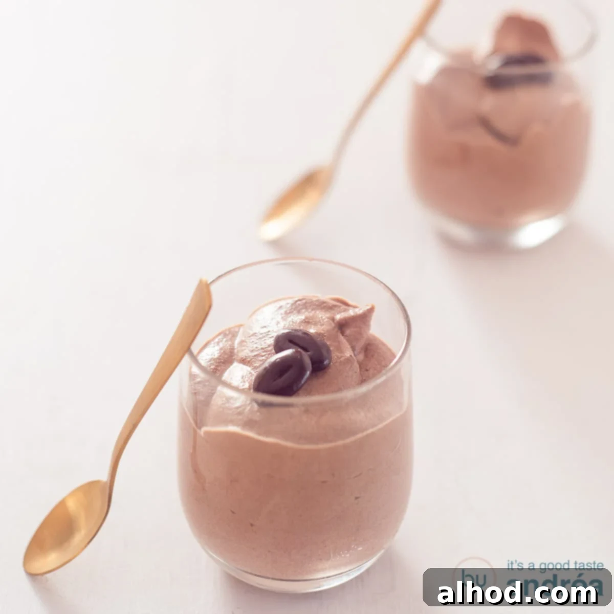 Velvety Milk Chocolate Mousse in Minutes 4 A square photo with two glasses filled with chocolate mousse
