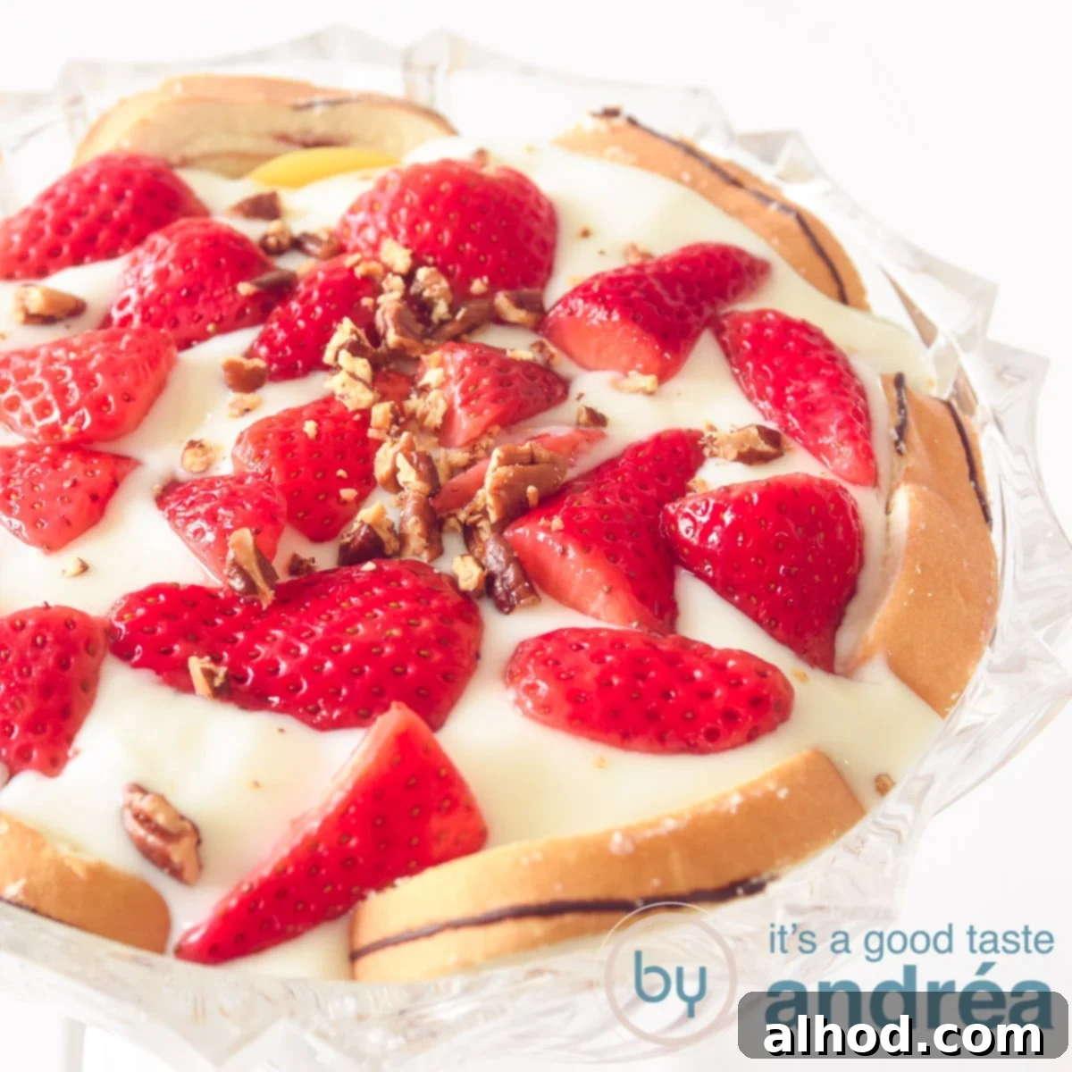 Peachy Strawberry Dream 5 A square photo with a glass bowl filled with layers of cake, cream, strawberries and pecans