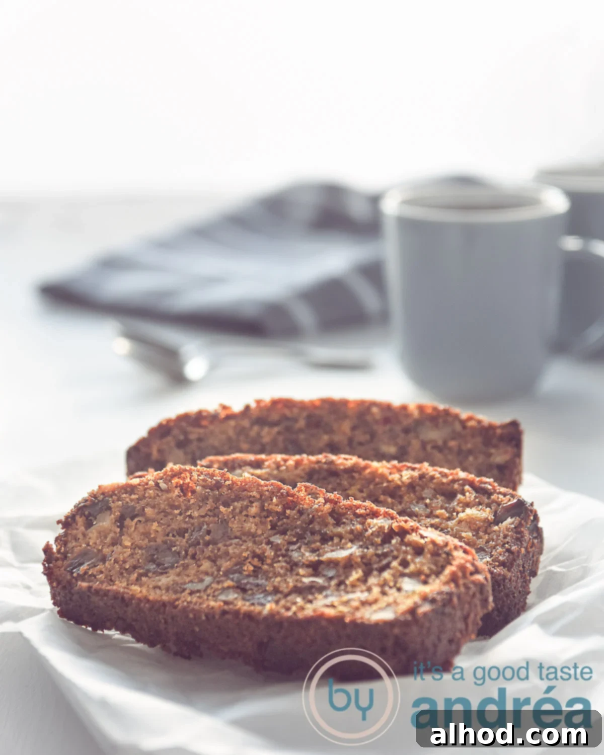 Spiced Date Apple and Walnut Cake 3 Close-up of a slice of Date, Apple, and Walnut cake on a plate.
