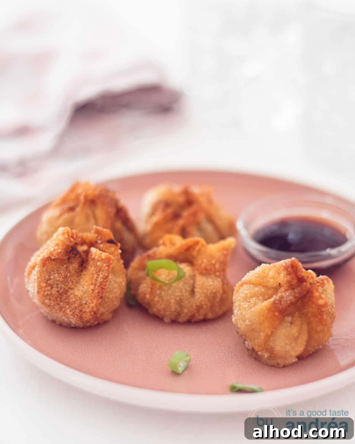 fried wonton with beef filling on spoons and two sauces