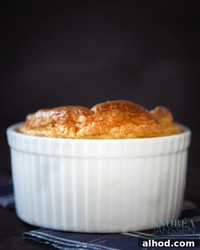Jerusalem artichoke soufflé baked to perfection in a ramekin, showcasing its beautiful golden crust and fluffy texture.