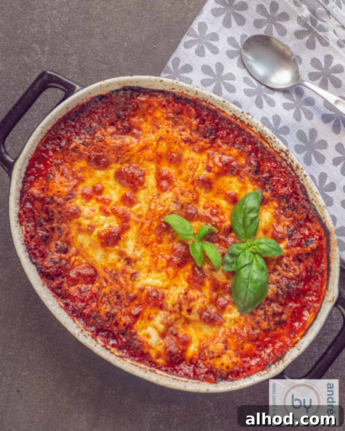 Simple Homemade Lasagna with Hearty Meat Sauce 2 A top down picture of a black casserole dish filled with homemade lasagna