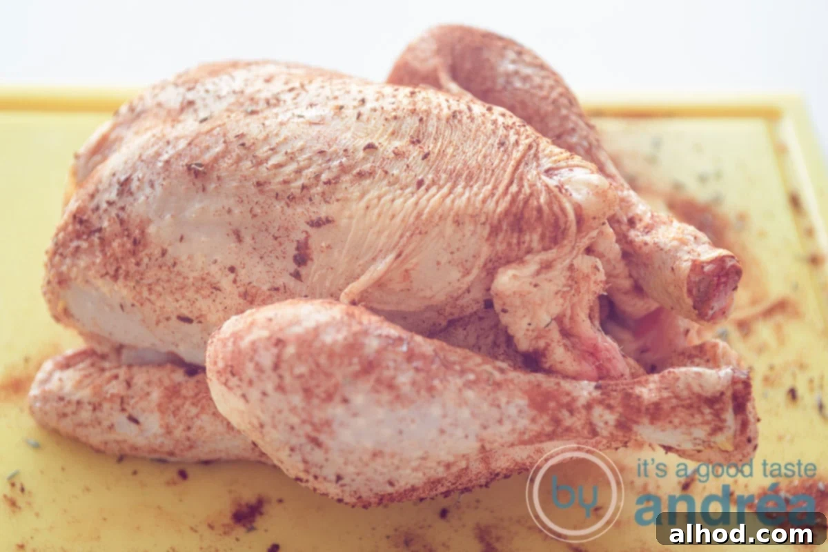 Easy Slow Cooker Rotisserie Chicken 4 a chicken rubbed with spices