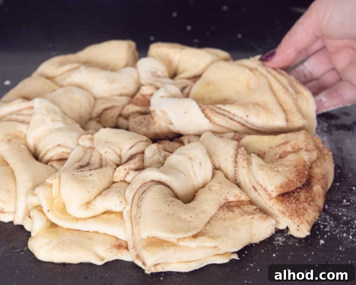 Starry Cinnamon Pull-Apart Bread 6 Folding the layers of dough into a star form