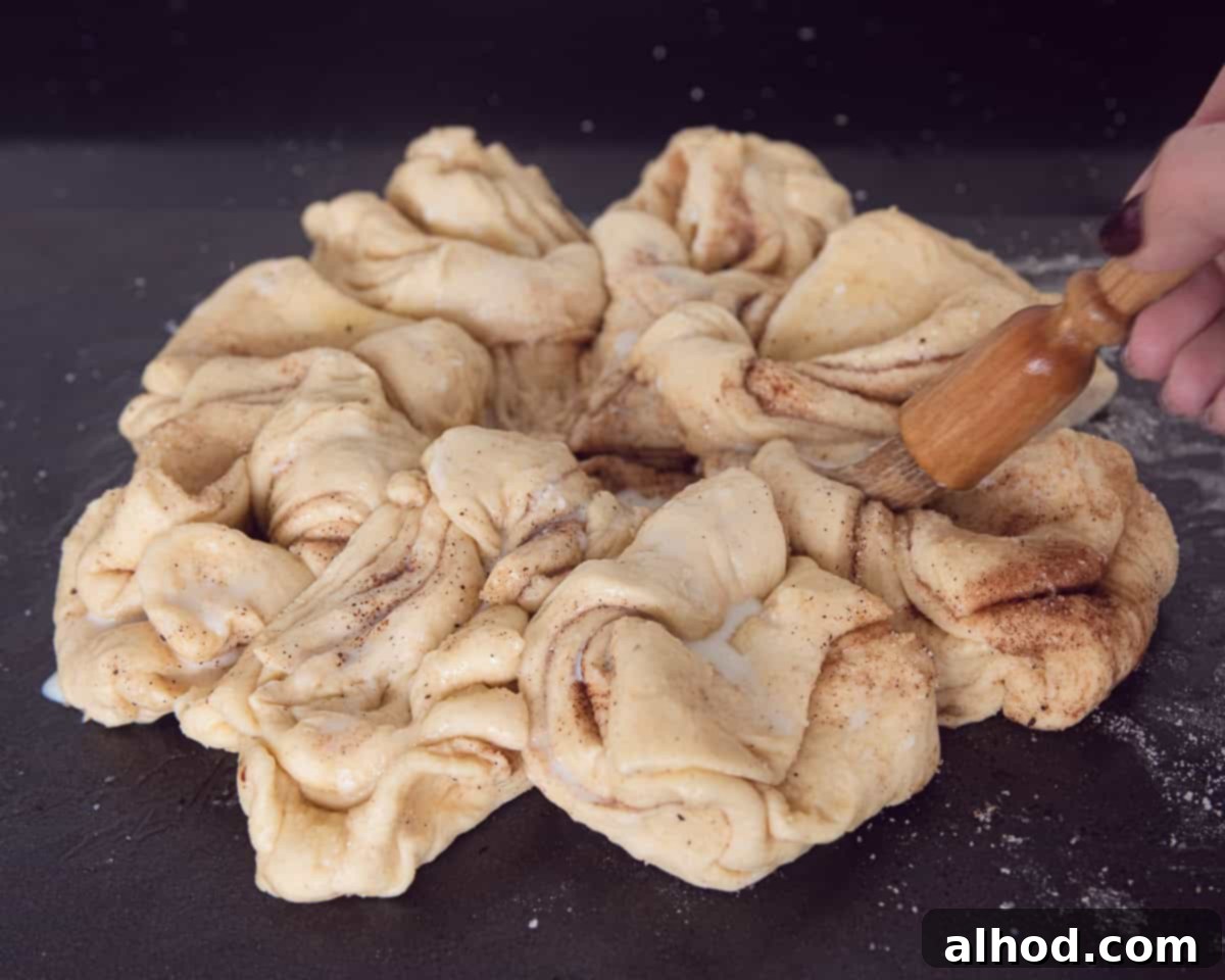Starry Cinnamon Pull-Apart Bread 7 Brushing milk on top of the sweet bread