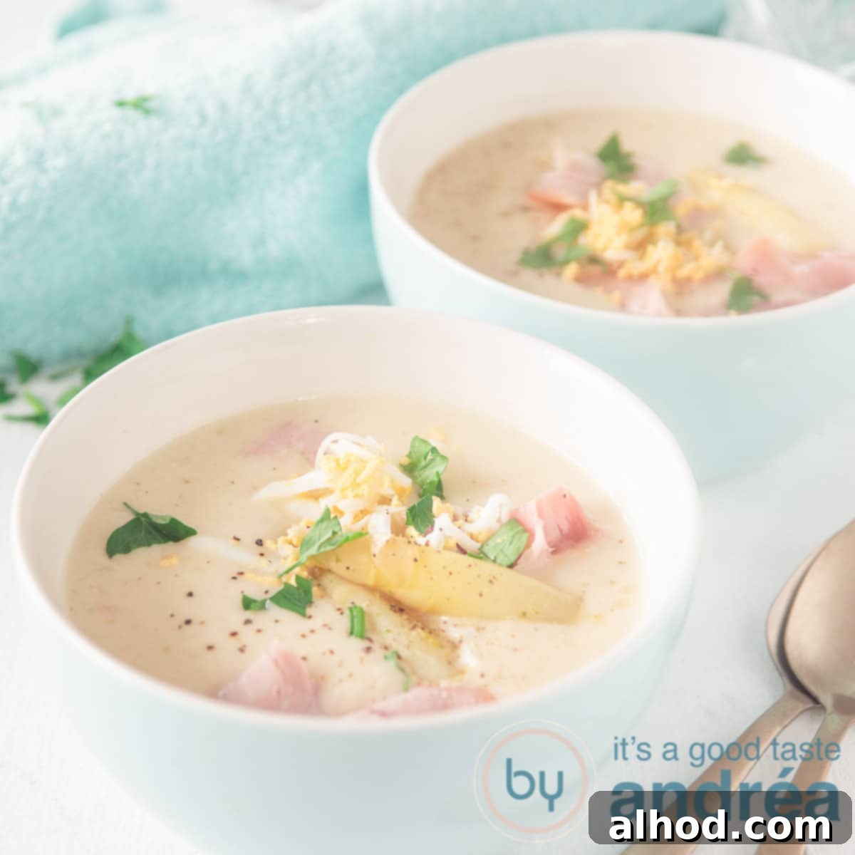 Velvety Dutch White Asparagus Soup 9 a square picture with two white cups of creamy asparagus soup
