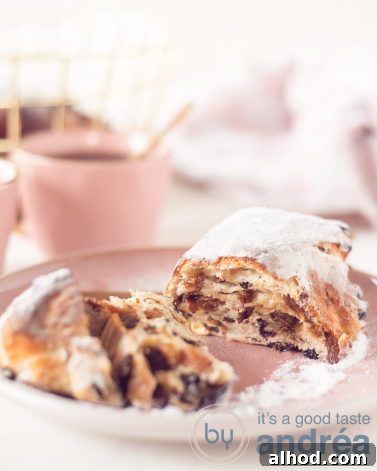 Zesty Orange Cinnamon Easter Stollen 2 slices Easter stollen with orange and cinnamon on a white plate