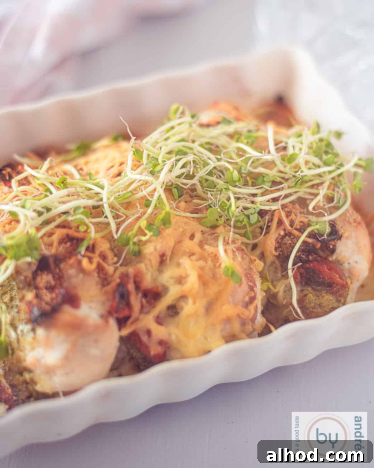 Golden Pesto Chicken with Sundried Tomatoes and Melty Mozzarella 3 A casserole with chicken fillet with pesto and cheese, freshly baked from the oven.