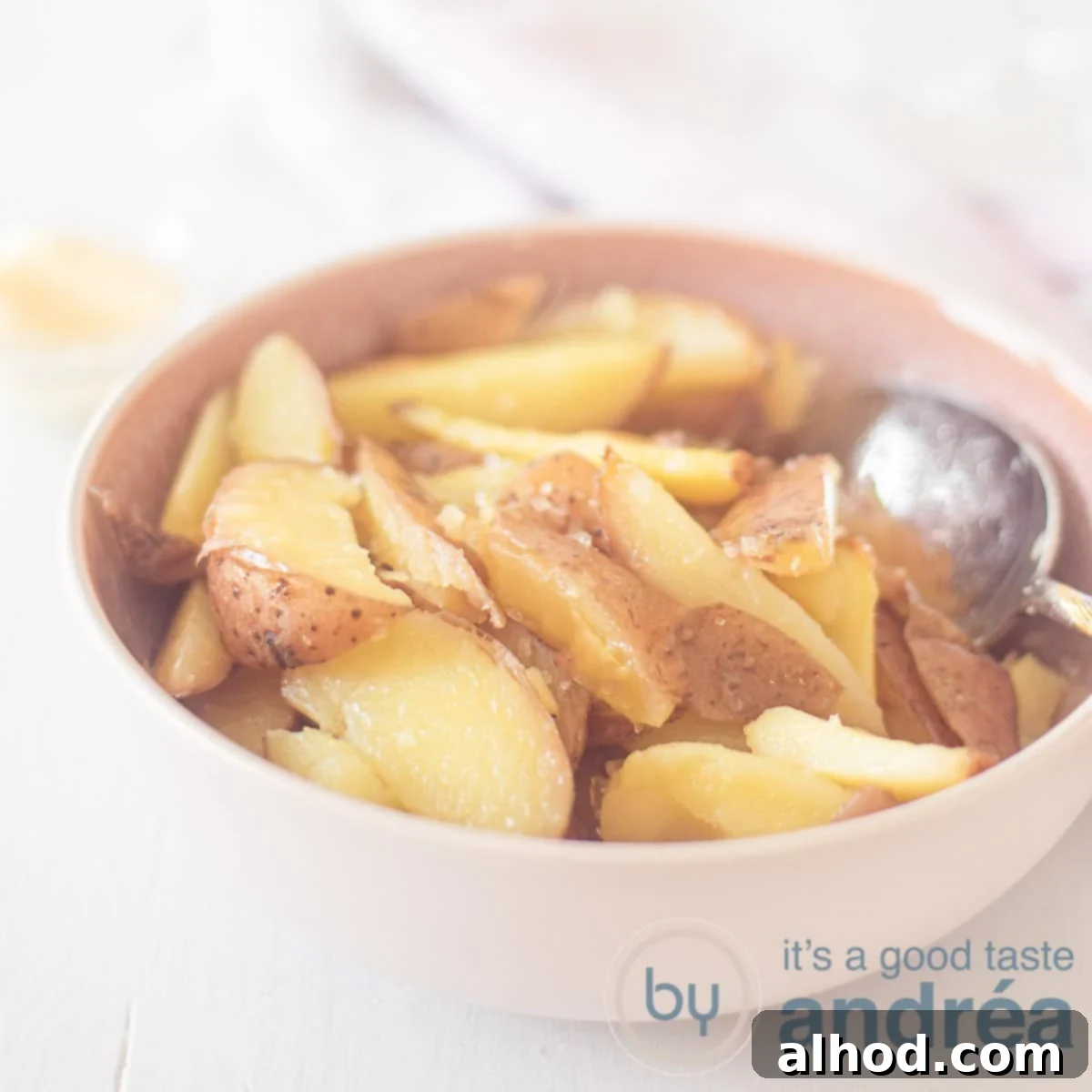 Crispy Oven Fries 6 A square photo with a pink dish with oven chips on it. A white background.