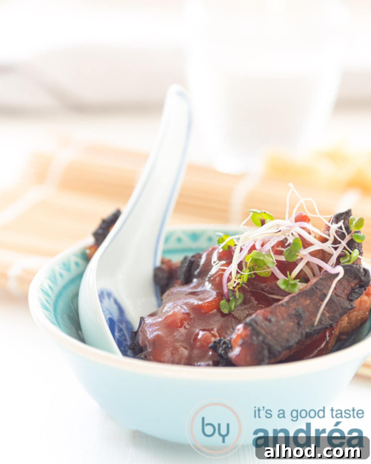 Authentic Chinese Babi Pangang Recipe 8 A vibrant close-up of finished Chinese Babi Pangang, showcasing the crispy pork and shiny sweet sauce in a bowl, ready to be served.