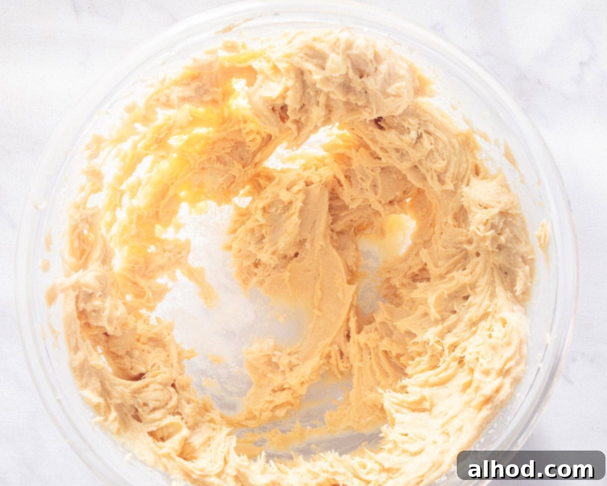 Effortless Salted Caramel Cupcake Delights 7 A glass bowl with caramel frosting