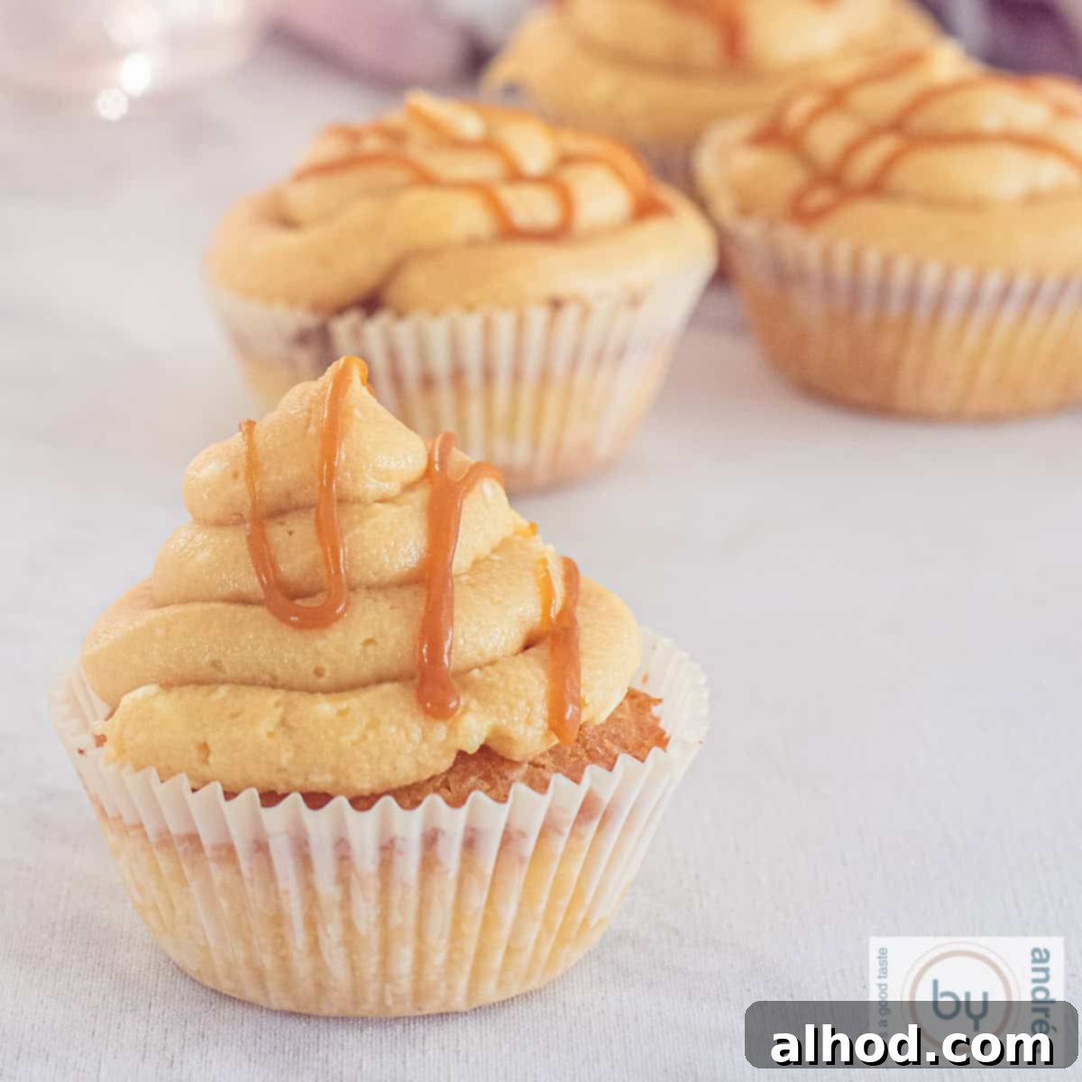 Effortless Salted Caramel Cupcake Delights 10 A square picture with cupcakes with caramel frosting and salted caramel drippings