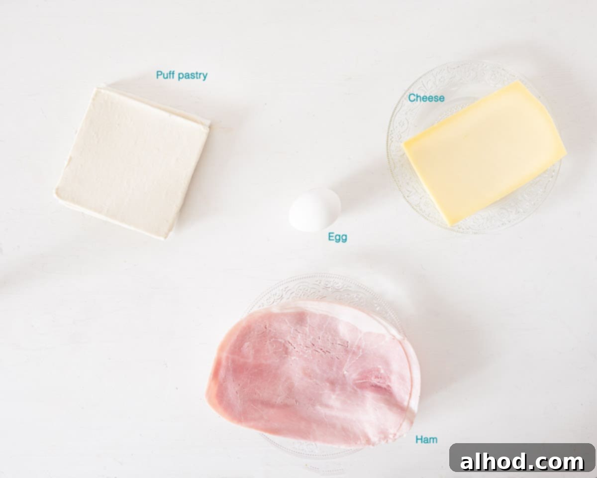 Flaky Ham and Cheese Puff Pastry Croissants 3 Ingredients for Ham and Cheese Puff Pastry Croissants, individually labelled on a white background, highlighting their simplicity.