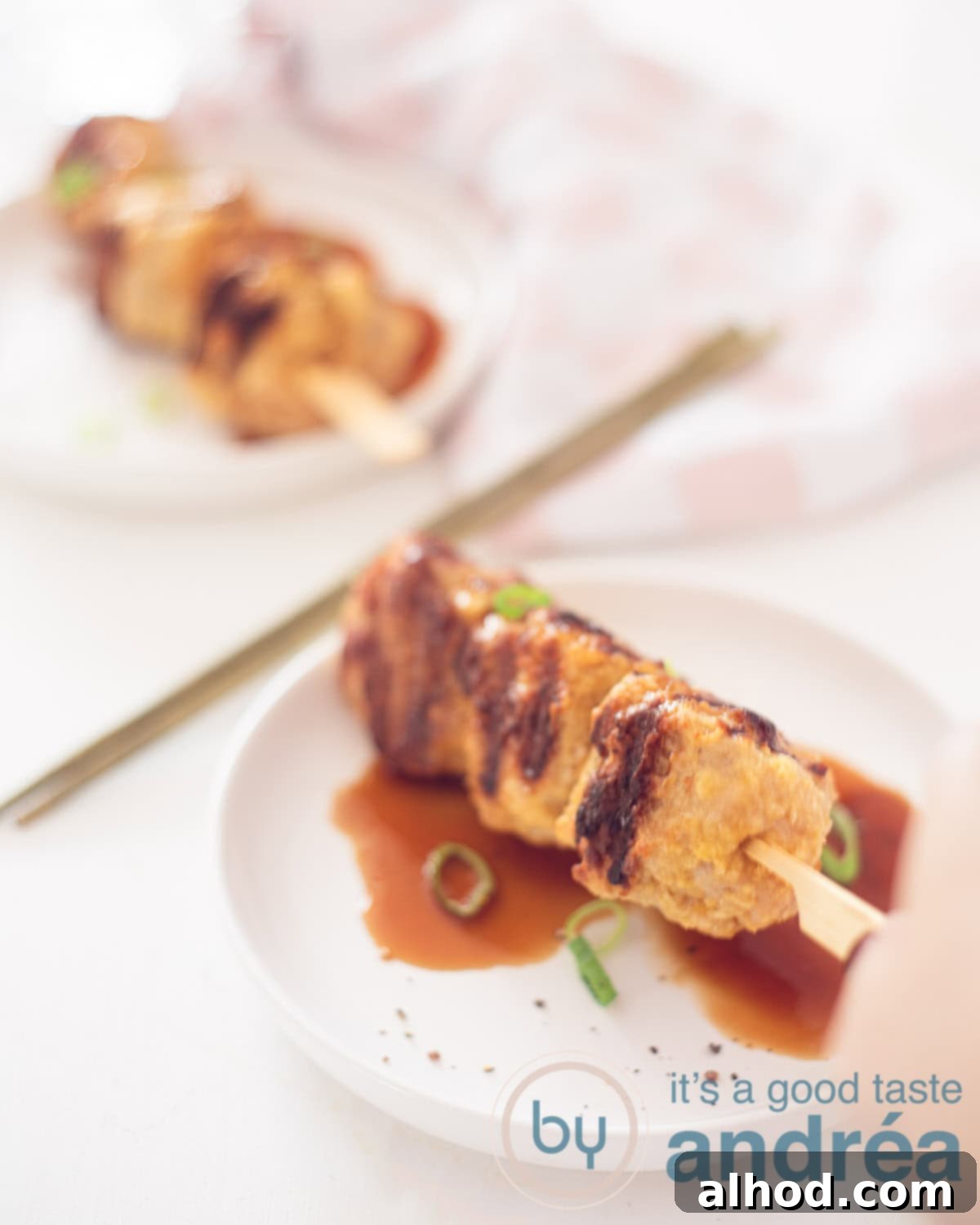 Tsukune Juicy Japanese Chicken Meatball Skewers with Teriyaki Sauce 2 Delicious Japanese chicken kebabs, which are grilled on a bbq of griddle. With the kebabs you serve a delicious sweet Yakitori sauce, homemade off course.