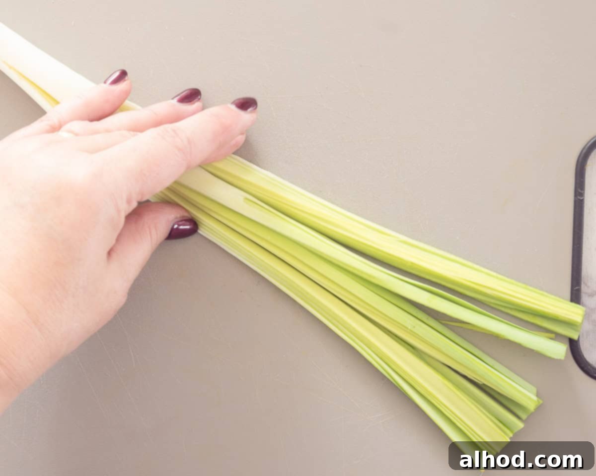 Effortless Leek Prep 5 A leek cut into quarters, held together by the root