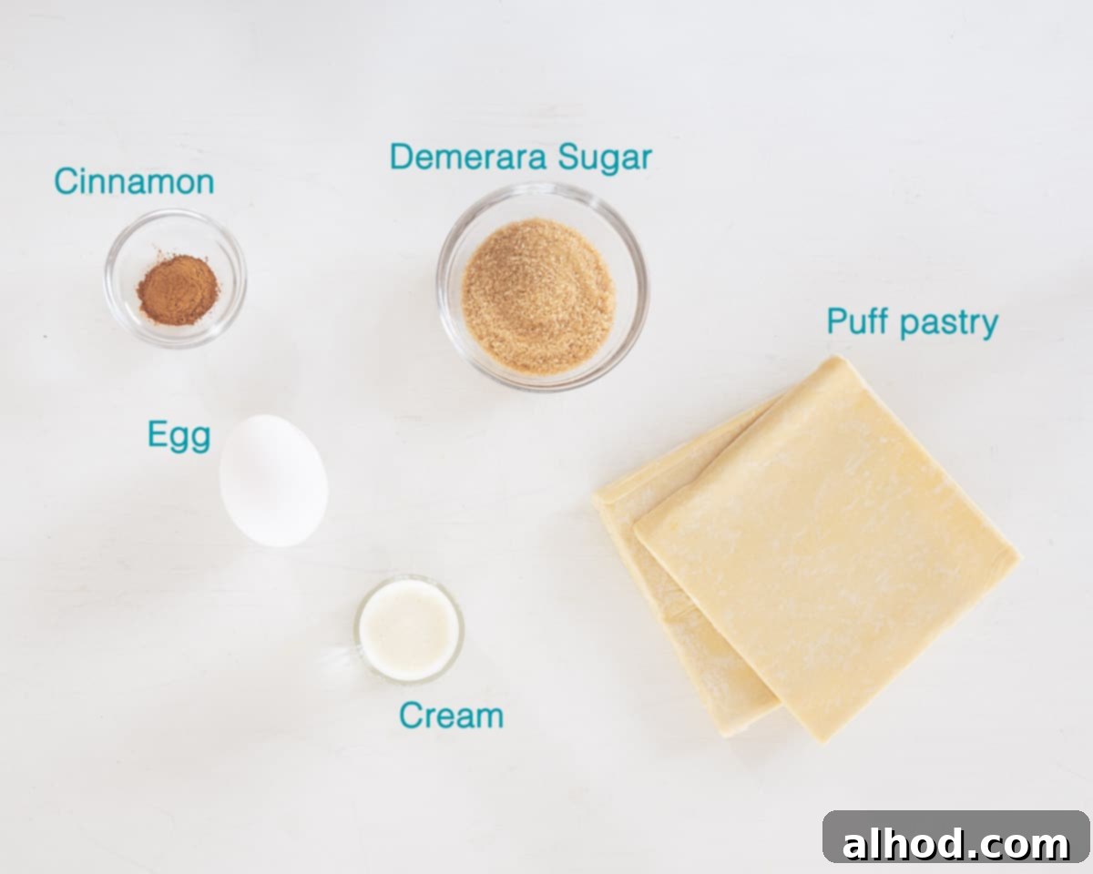 Krakelingen Sweet Dutch Pretzel Delights 3 Individual ingredients for Krakelingen Dutch Sweet Pretzel Cookies, including puff pastry, egg yolk, cream, cinnamon, and demerara sugar, are neatly labeled on a clean white background.