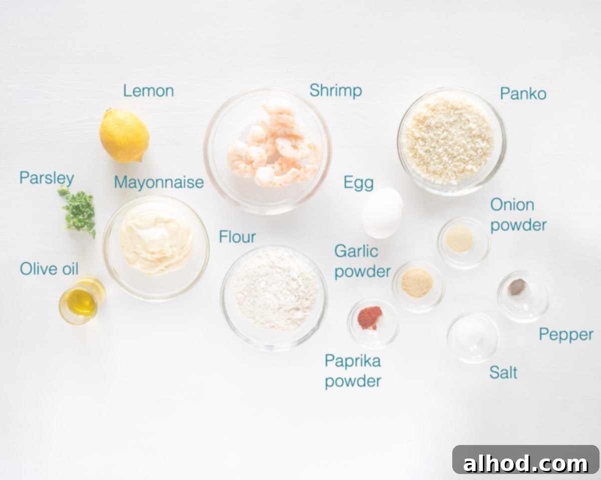 Crispy Garlic Shrimp Bites with Tangy Lemon Aioli 3 A collection of fresh ingredients laid out, including shrimp, lemon, parsley, mayonnaise, panko breadcrumbs, and various spices for the garlic shrimp and lemon aioli dip.