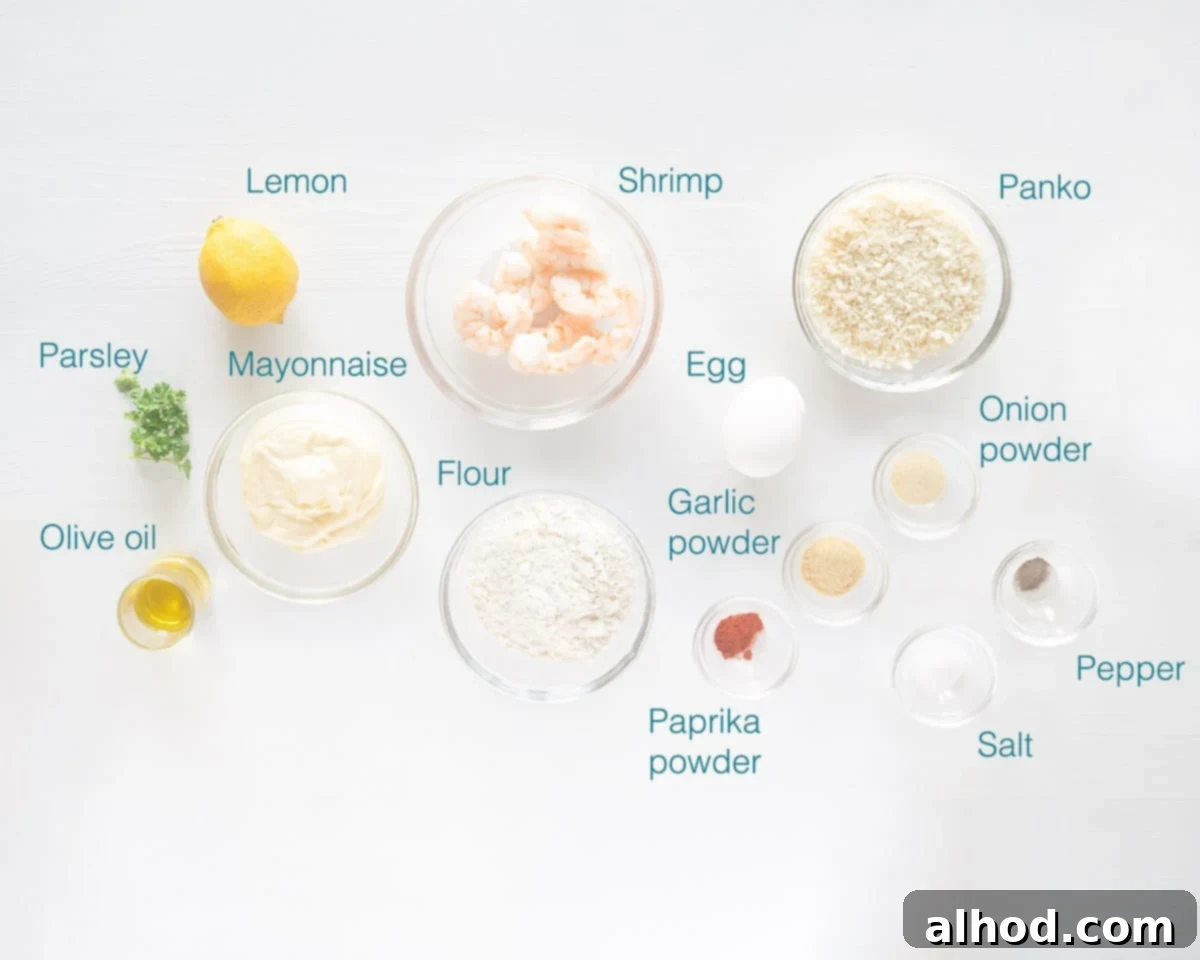 Crispy Air Fried Garlic Shrimp with Zesty Lemon Aioli 3 A collection of ingredients laid out, including raw shrimp, flour, egg, panko, and various spices for the garlic shrimp, alongside mayonnaise, lemon, garlic, and parsley for the aioli dip.
