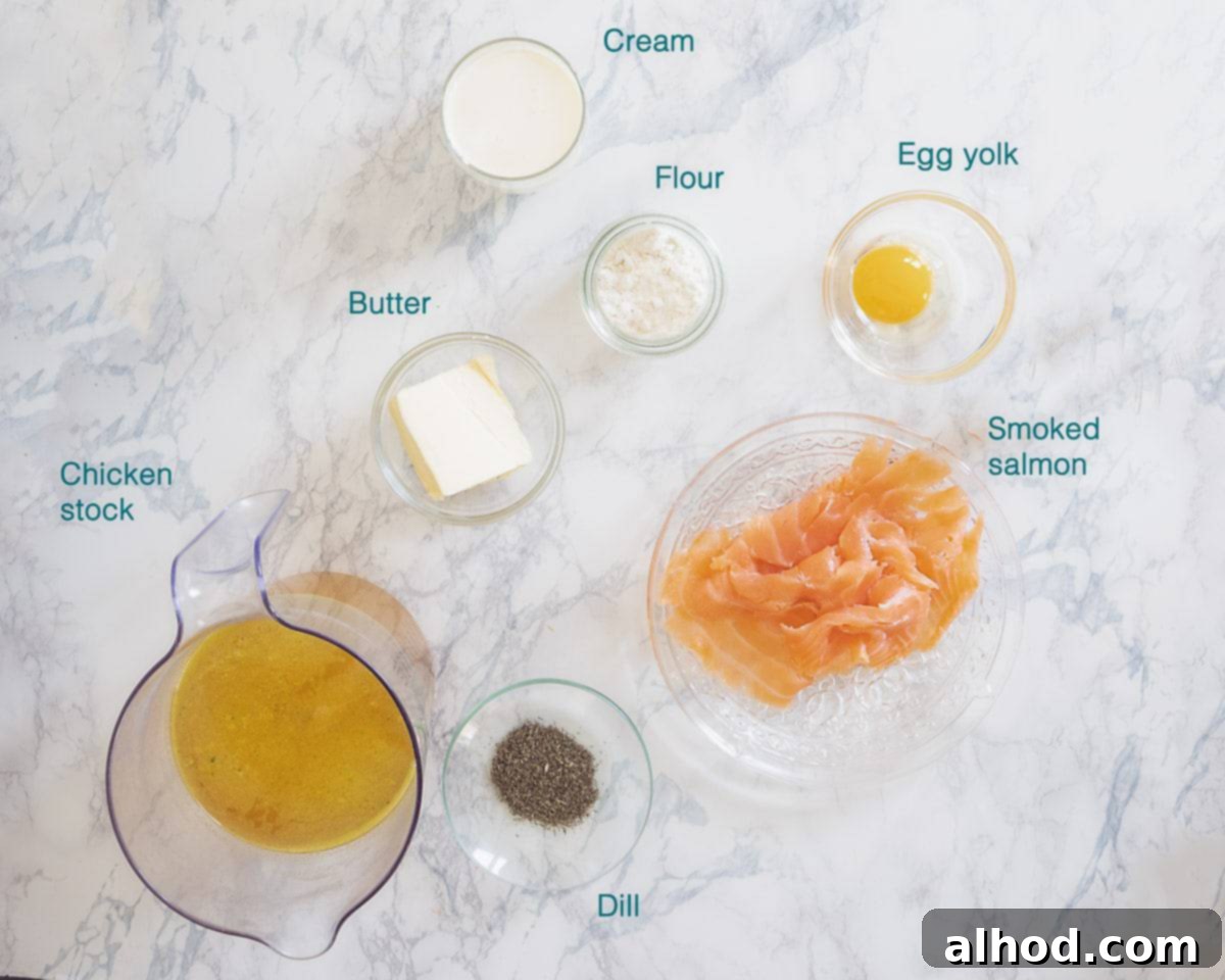 Regal Dutch Broth 3 A beautifully arranged overhead photo showing all the individual ingredients for Dutch Koninginnensoep, labelled clearly on a white marbled background, including butter, flour, chicken stock, egg yolk, cream, dill, and smoked salmon.