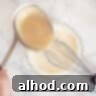 A tablespoon of thickened chicken soup is added to the egg and cream mixture.