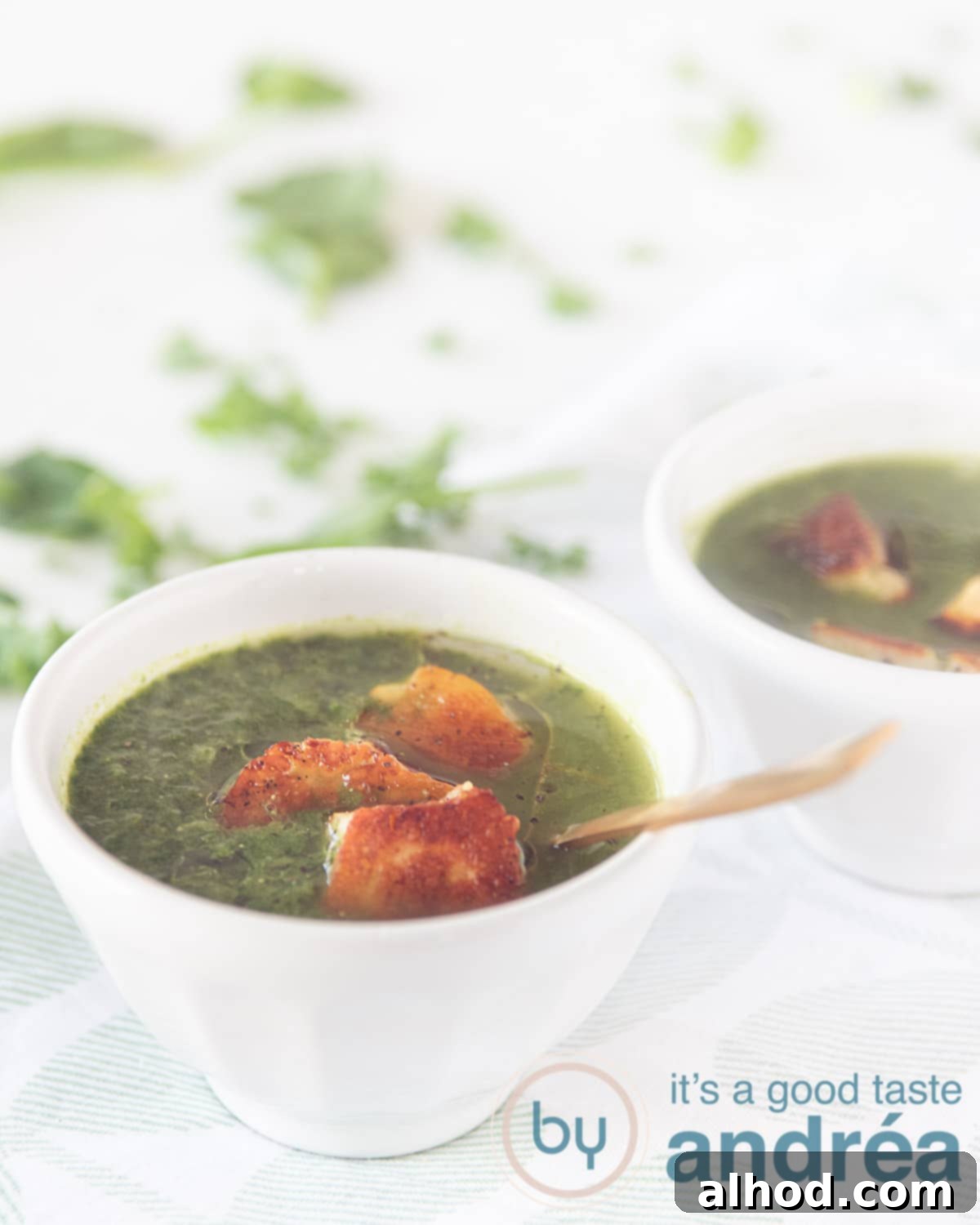 Nourishing Bok Choy Garden Soup 9 a white bowl bok choy and kale spinach soup with Halloumi on white background