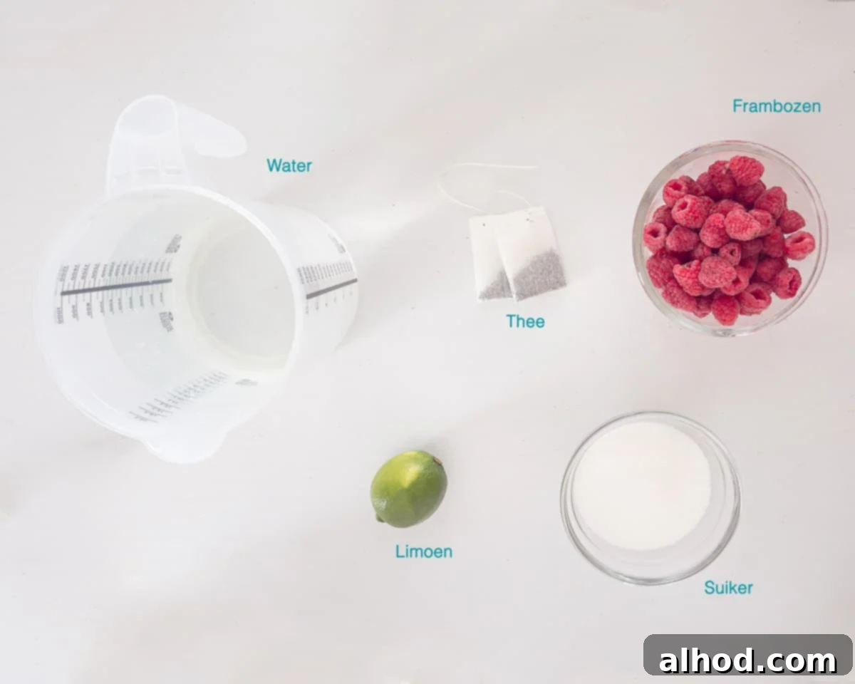 Aromatic Rose & Zesty Lime Iced Tea 3 Ingrediënten Limoen Rozen Ice Tea - showing fresh lime, raspberries, sugar, and tea bags.