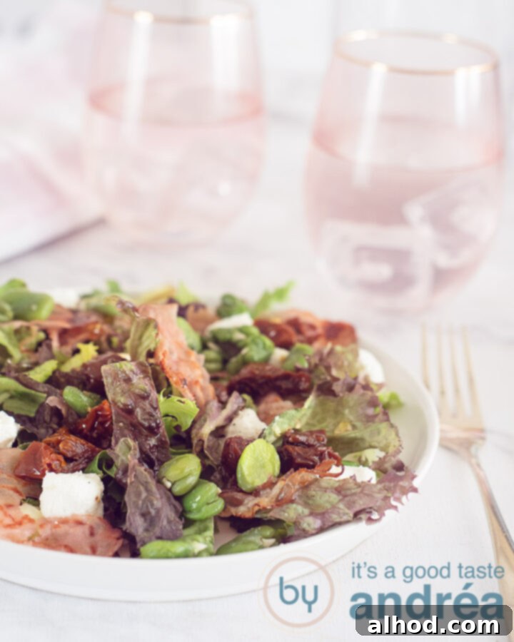 Spring Broad Bean, Bacon, and Goat Cheese Salad 5 A close-up shot of the finished broad bean salad, highlighting the vibrant green beans, creamy goat cheese, and golden bacon bits. The salad is beautifully plated, showcasing its appetizing appeal.