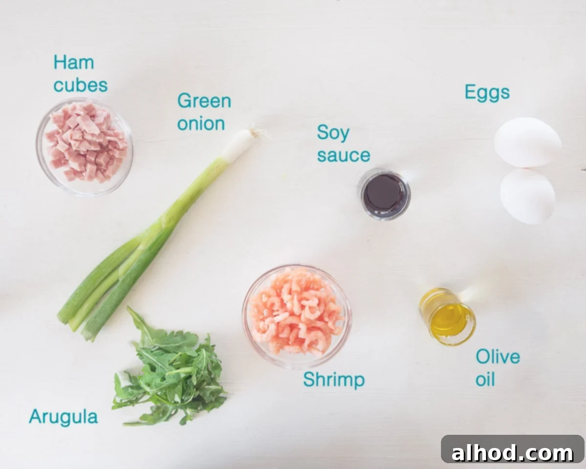 Savory Shrimp Omelette 3 A pristine white background showcases the individual ingredients for a Shrimp Omelette, each clearly labeled: eggs, cooked cocktail shrimp, diced ham, fresh arugula, chopped spring onions, olive oil, and a bottle of Kecap Manis.