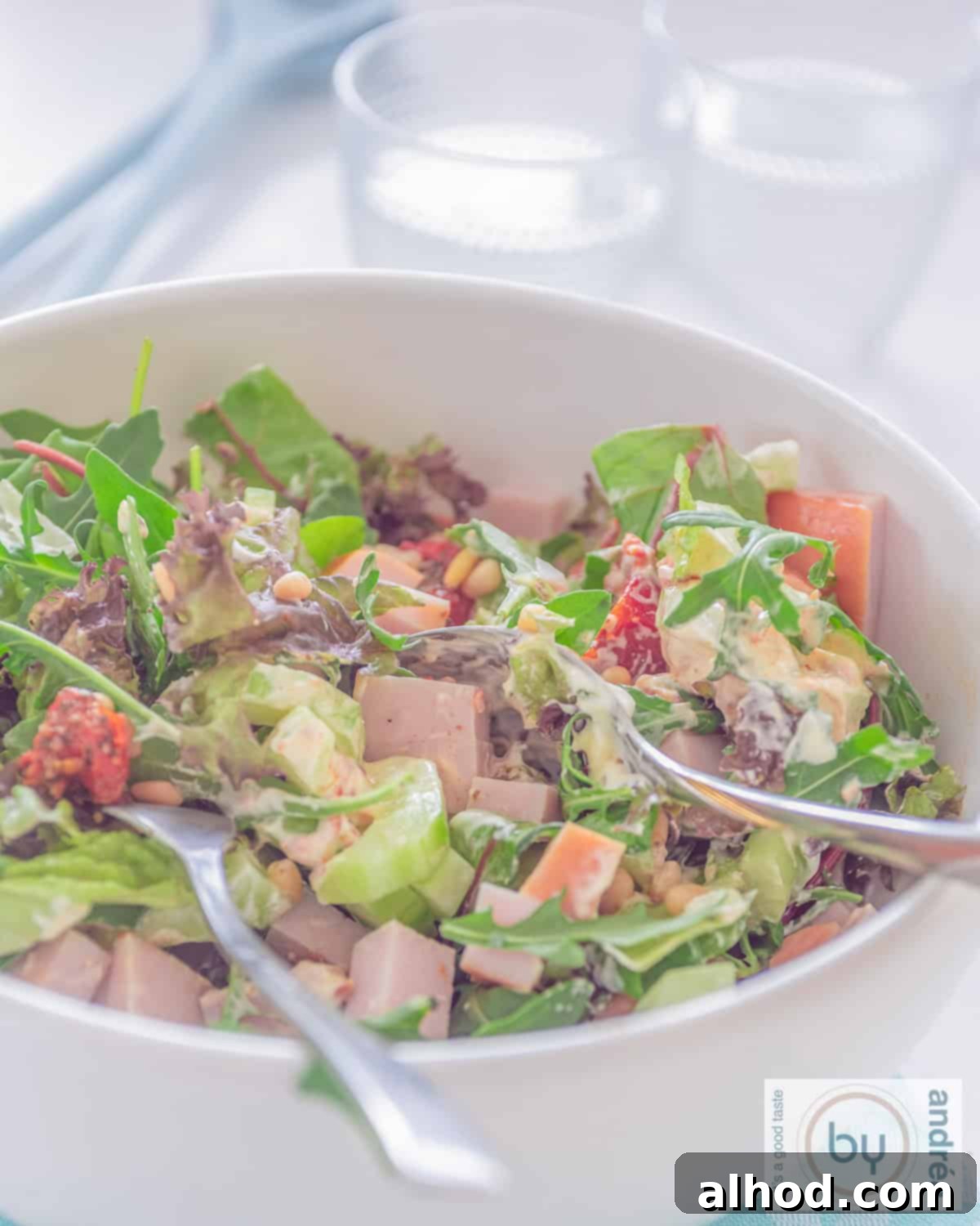 Flavorful Smoked Chicken Salad Made in 10 Minutes 3 A generous serving of Smoked Chicken Salad presented in a large bowl, showcasing the succulent chicken, sun-dried tomatoes, and creamy pesto dressing.