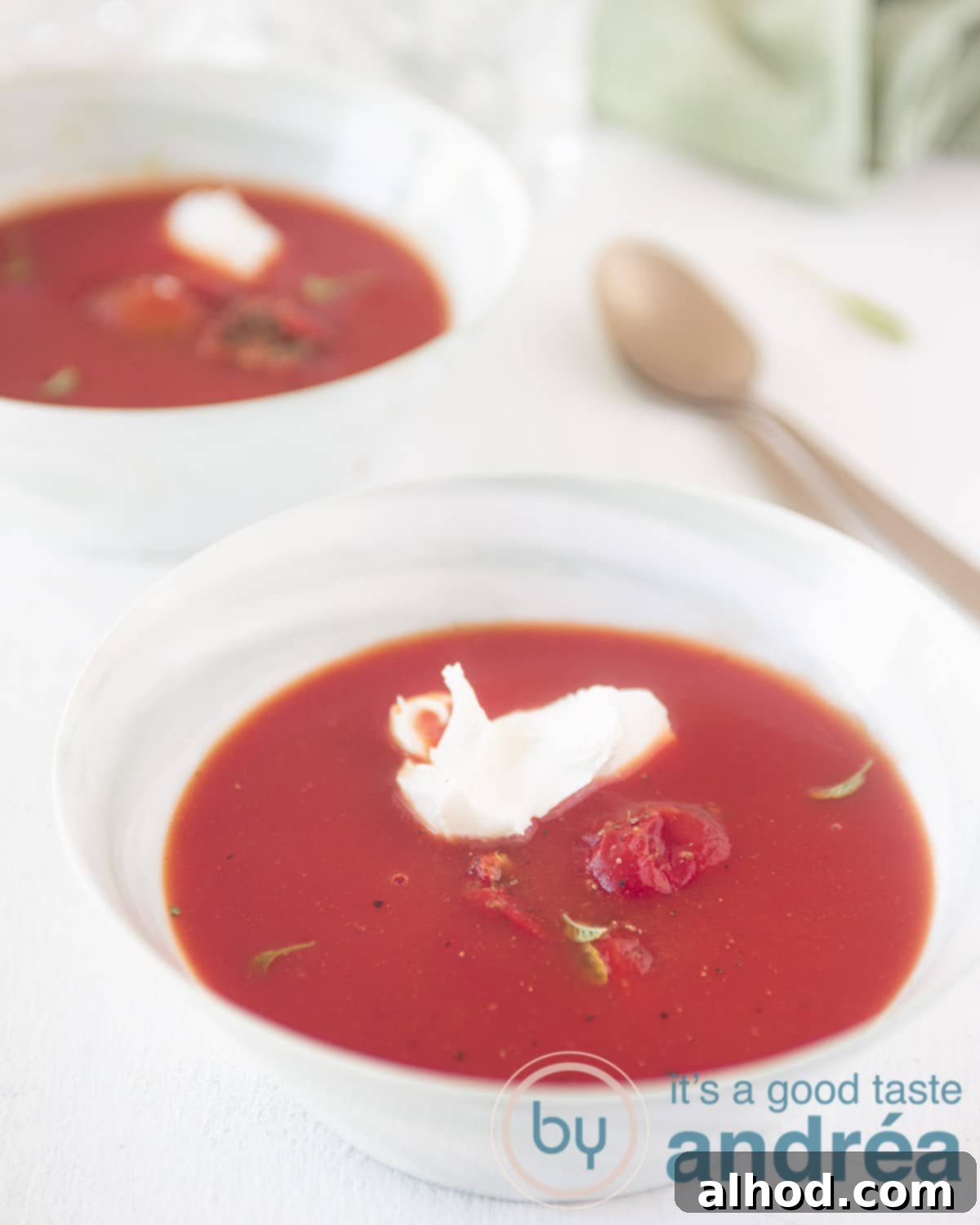 Creamy Tomato Mascarpone Soup 2 Two bowls of creamy Italian tomato soup with mascarpone, garnished with fresh herbs, ready to be served