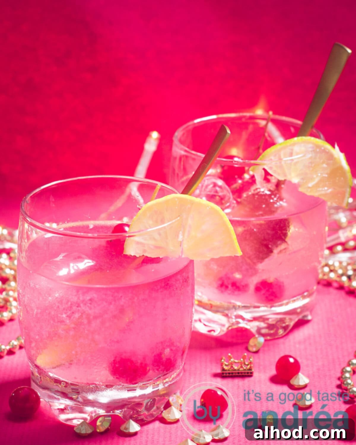 Simple and Refreshing Red Currant Caipirinha 2 Two glasses of Caipirinha with red currants on a red background, garnished with lime wedges and fresh berries, evoking a refreshing summer drink.