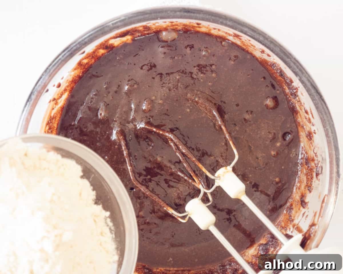 Decadent Chocolate Cheesecake Brownies 5 Flour added to the brownie batter.