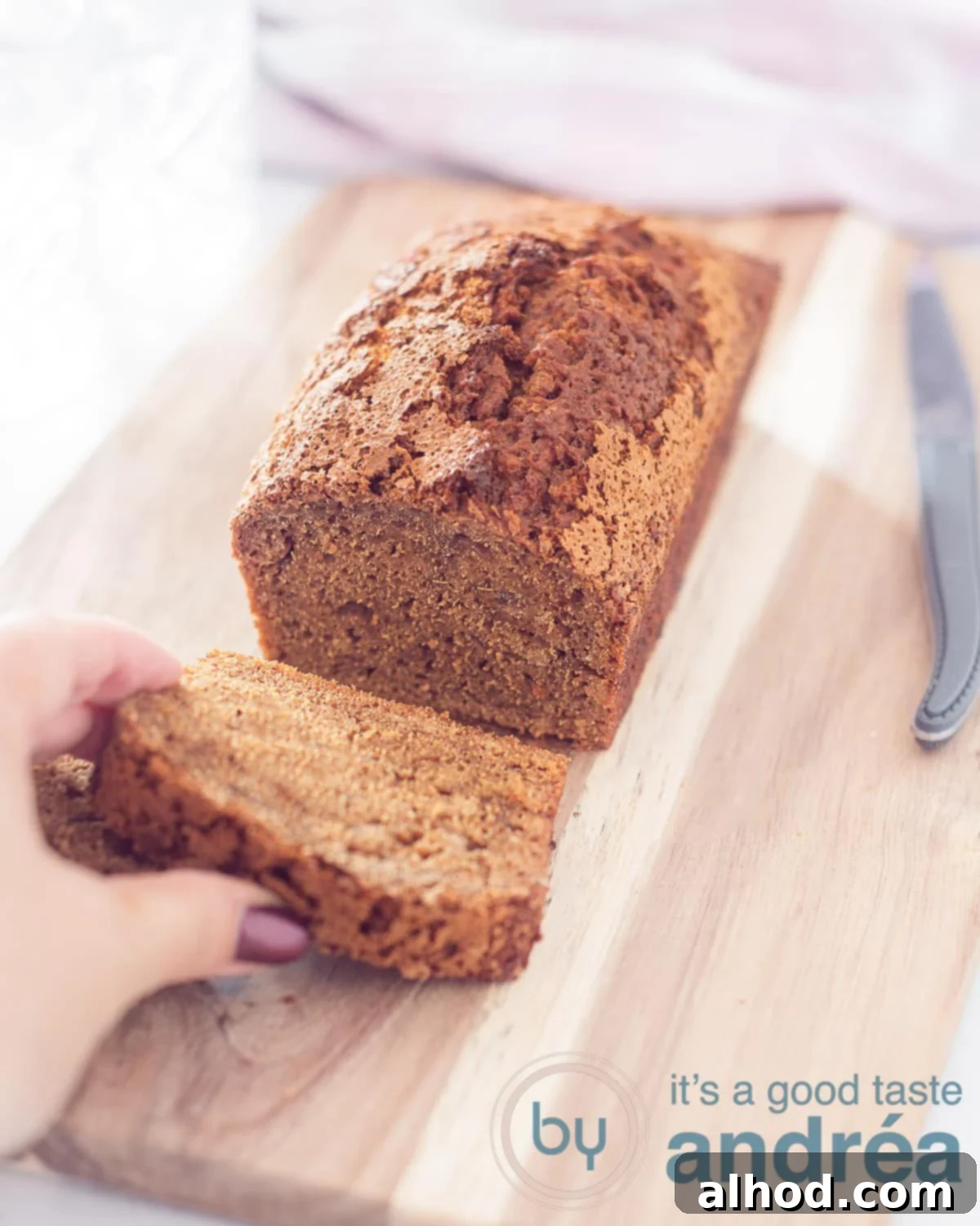 Guilt-Free Sweet Morning Cake 5 Photo from above of gingerbread. lies on a baking paper that is on a grid. A knife on the right side. Ideal for a healthy breakfast or snack.