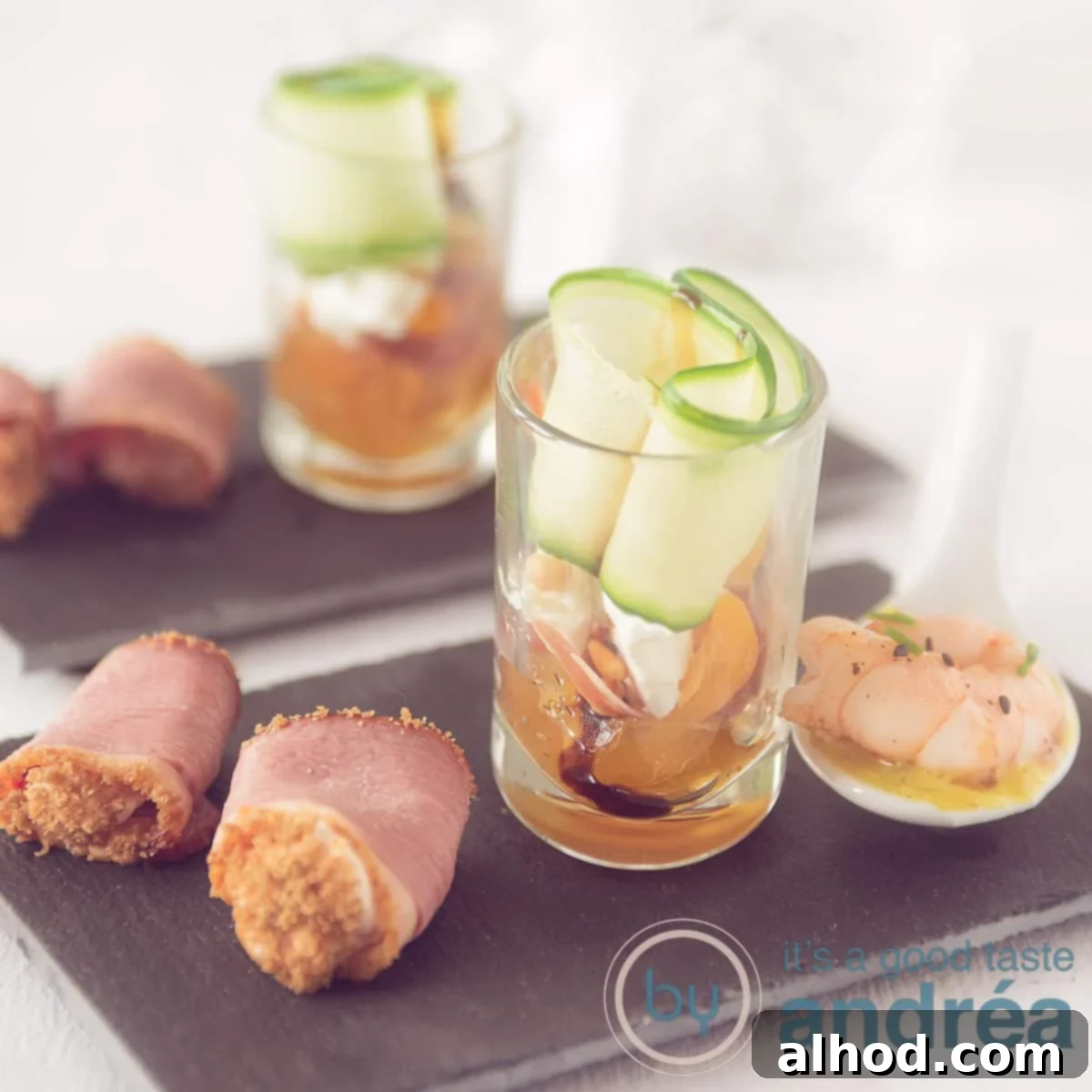 Ham Shrimp and Goat Cheese Amuse Bouche Trio 10 A square photo with two black pictures in a row, each with three appetizers, a roll, a salad and a spoon snack